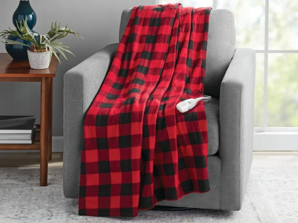 red black plaid heated throw over a chair