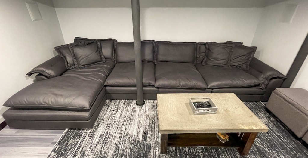 gray sectional cloud couch dupe in basement