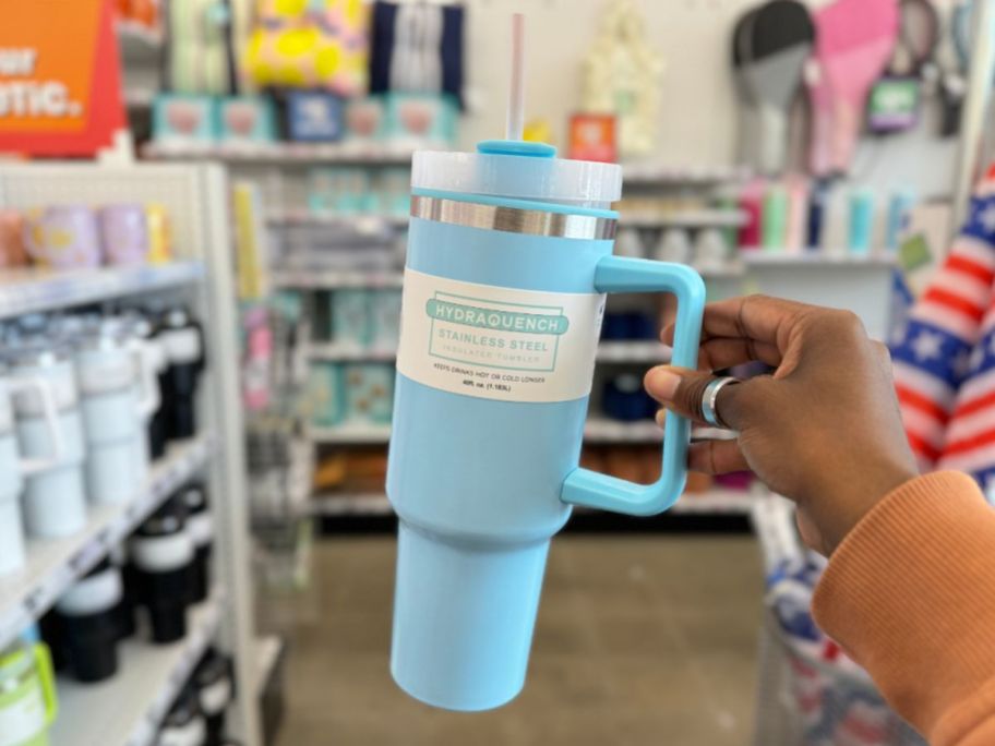 A hand holding a 5 Below Hydraquench Stainless Steel Insulated Tumbler in light blue
