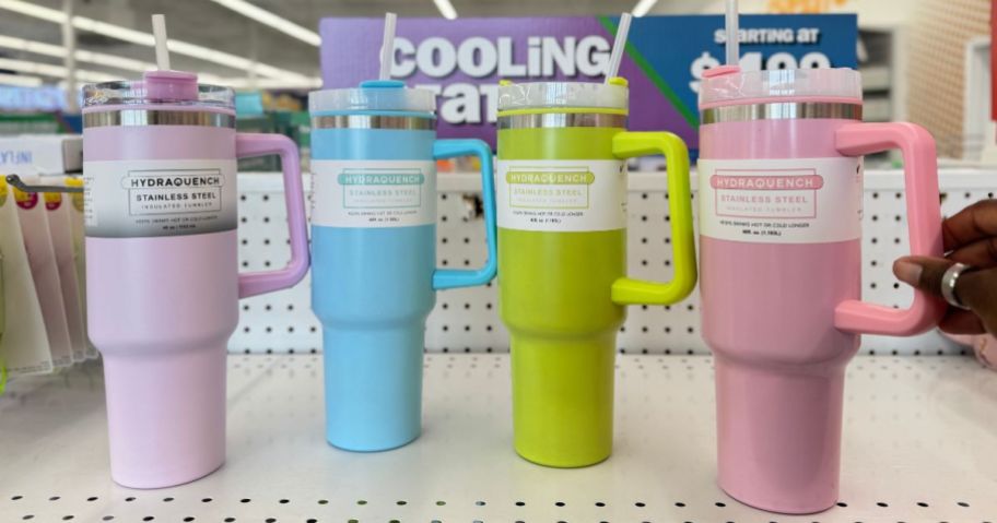 Four 5 Below Hydraquench Stainless Steel Insulated Tumblers on a shelf