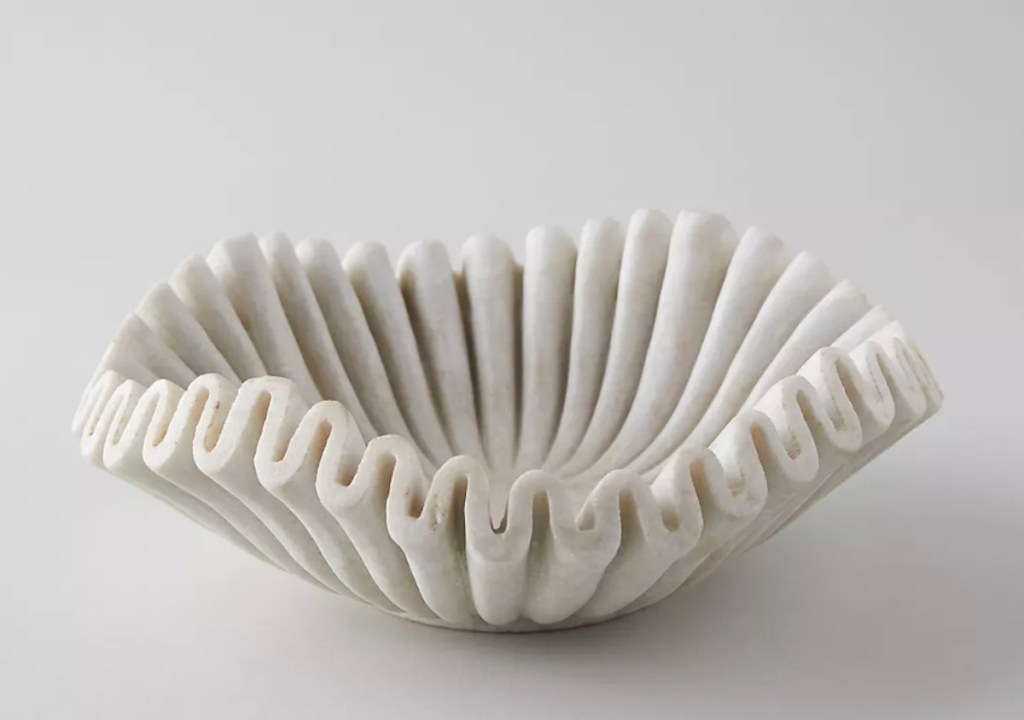 Stock photo of white marble ruffled bowl