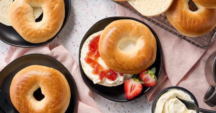 bagels spread with jam and cream cheese