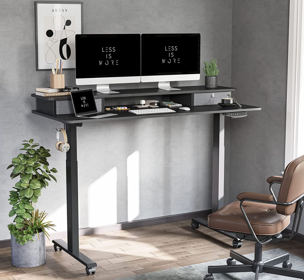 Room with a BANTI adjustable height desk with storage and a second tier for elevating your computer monitors.