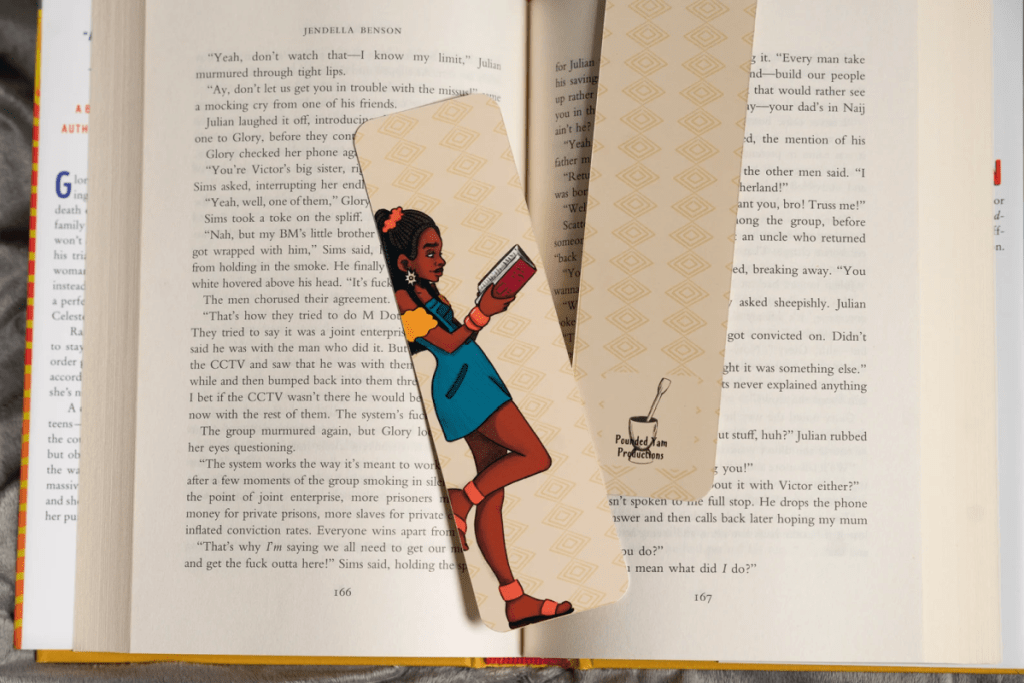A Black Girl Reading bookmark from Pounded Yam Productions