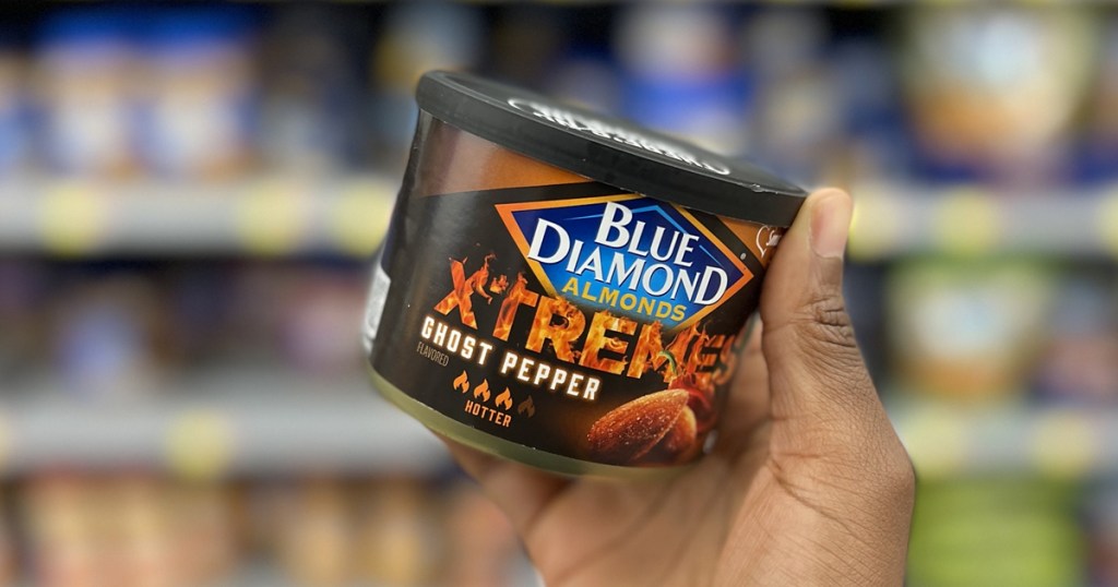 hand holding can of Blue Diamond Xtremes Ghost Pepper almonds