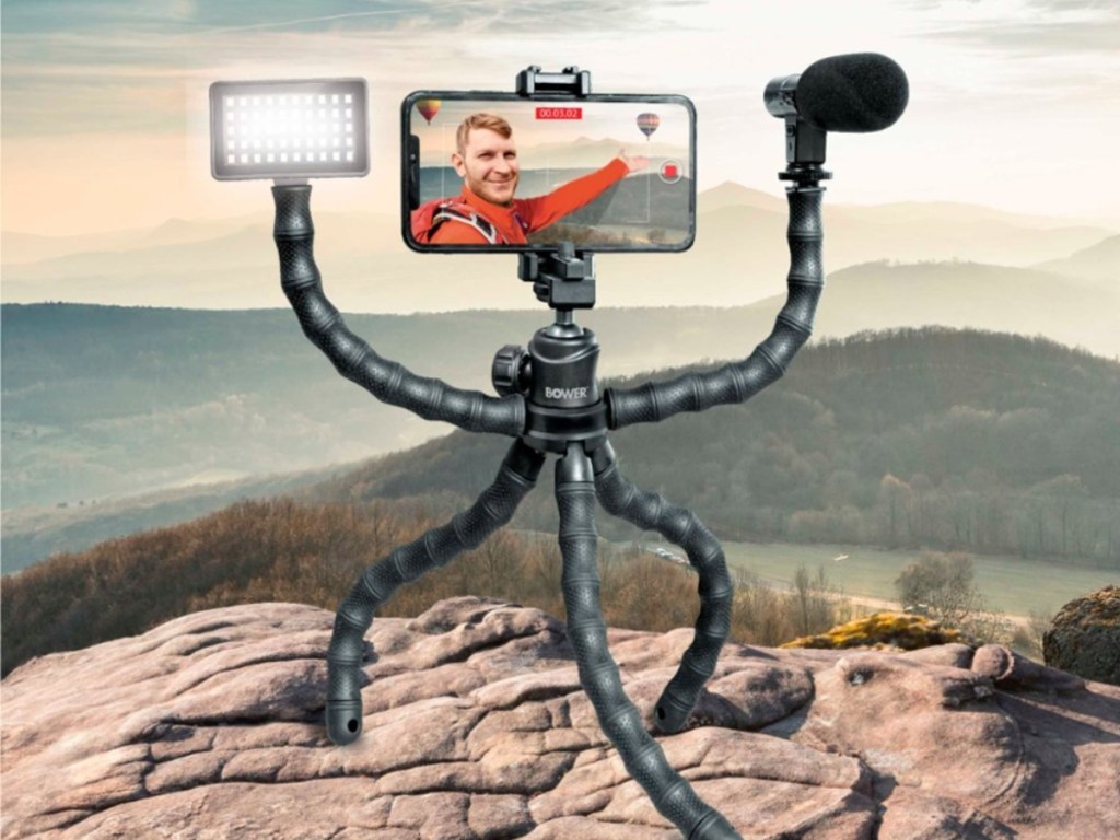 flexible tripod holding phone, light, and microphone