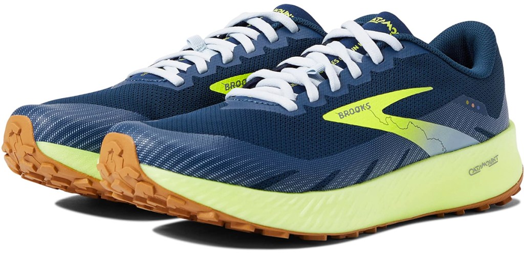 blue and green pair of brooks running shoes
