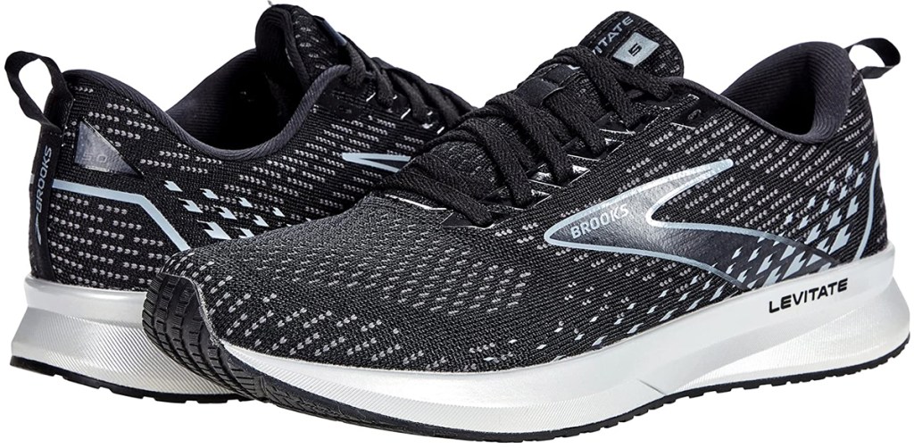 pair of black and white brooks running shoes