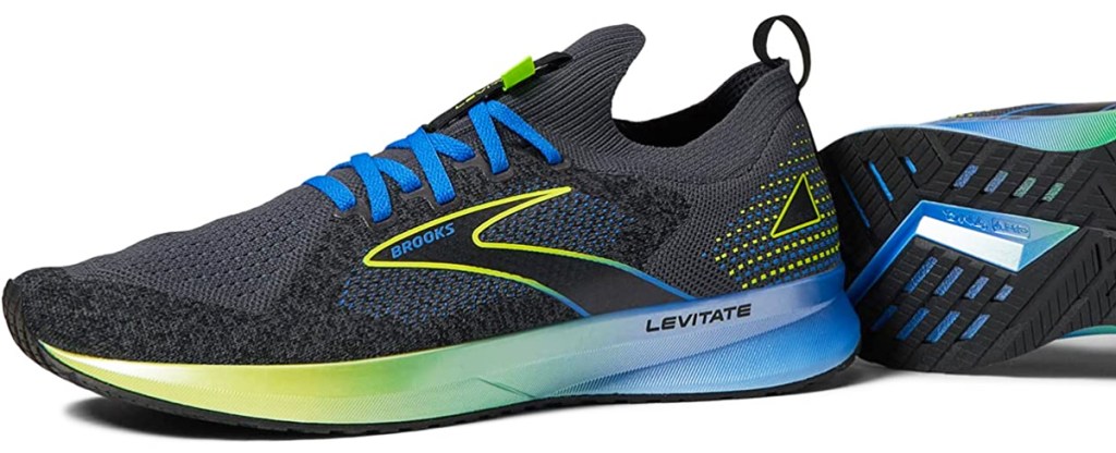 black, green, and blue brooks running shoe