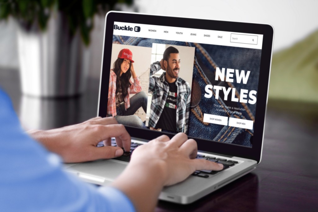 Man browsing the Buckle website for new clothes