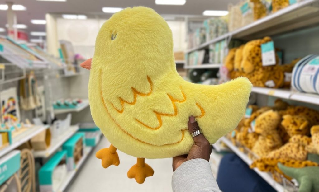 Chick Shaped Pillow being held by a person in Target