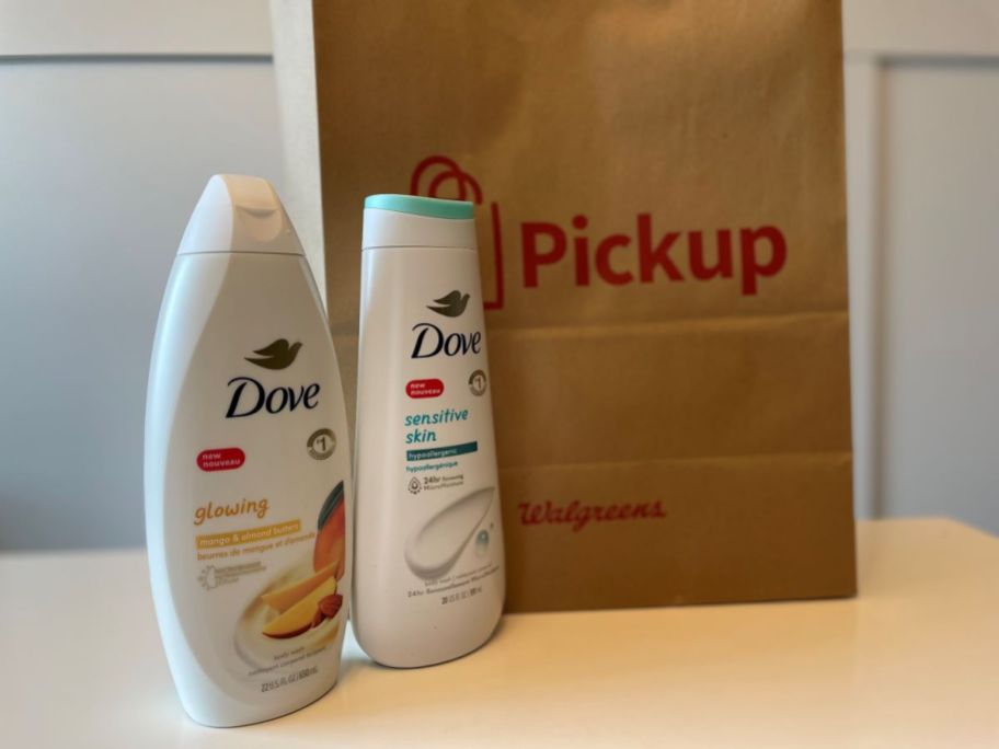 Two bottles of Dove body wash next to a Walgreens bag