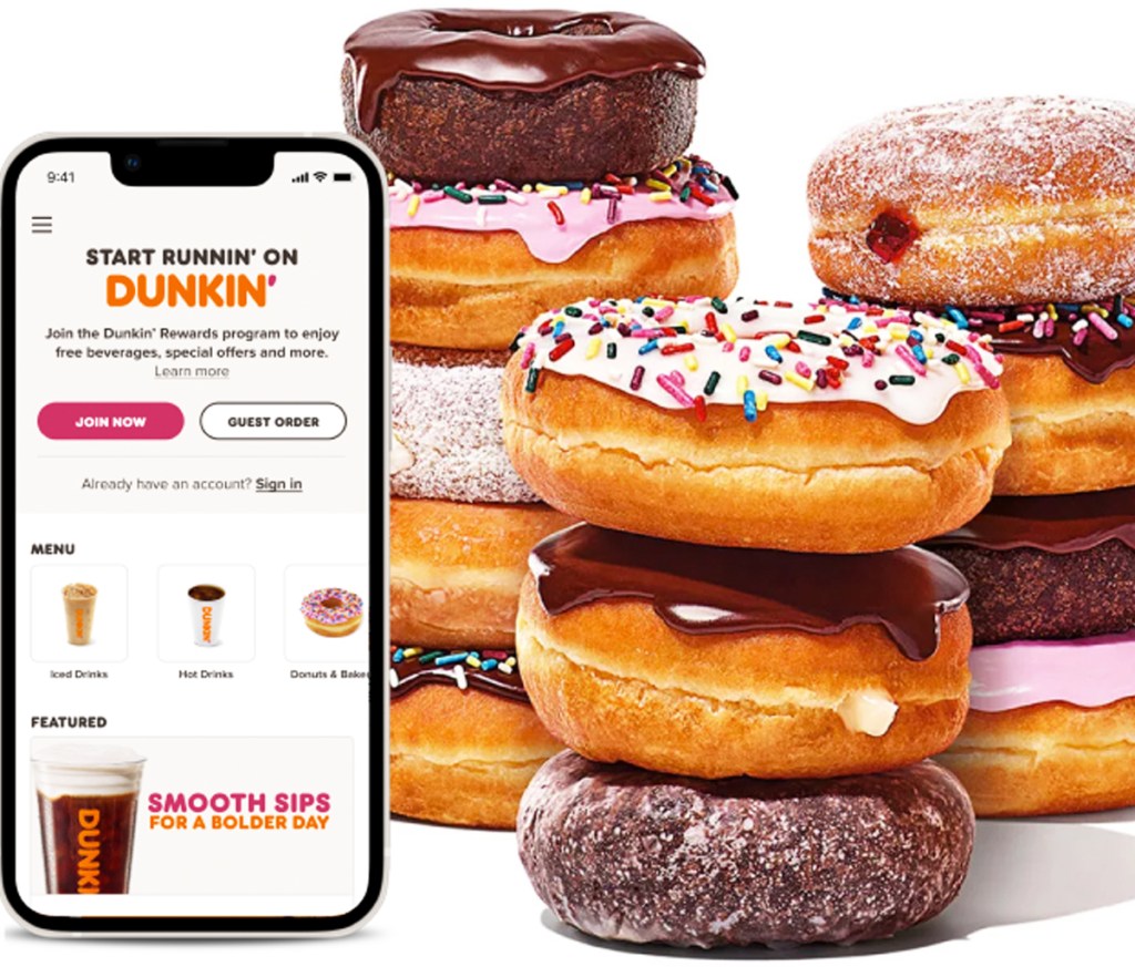 iPhone with dunkin rewards program next to stack of donuts