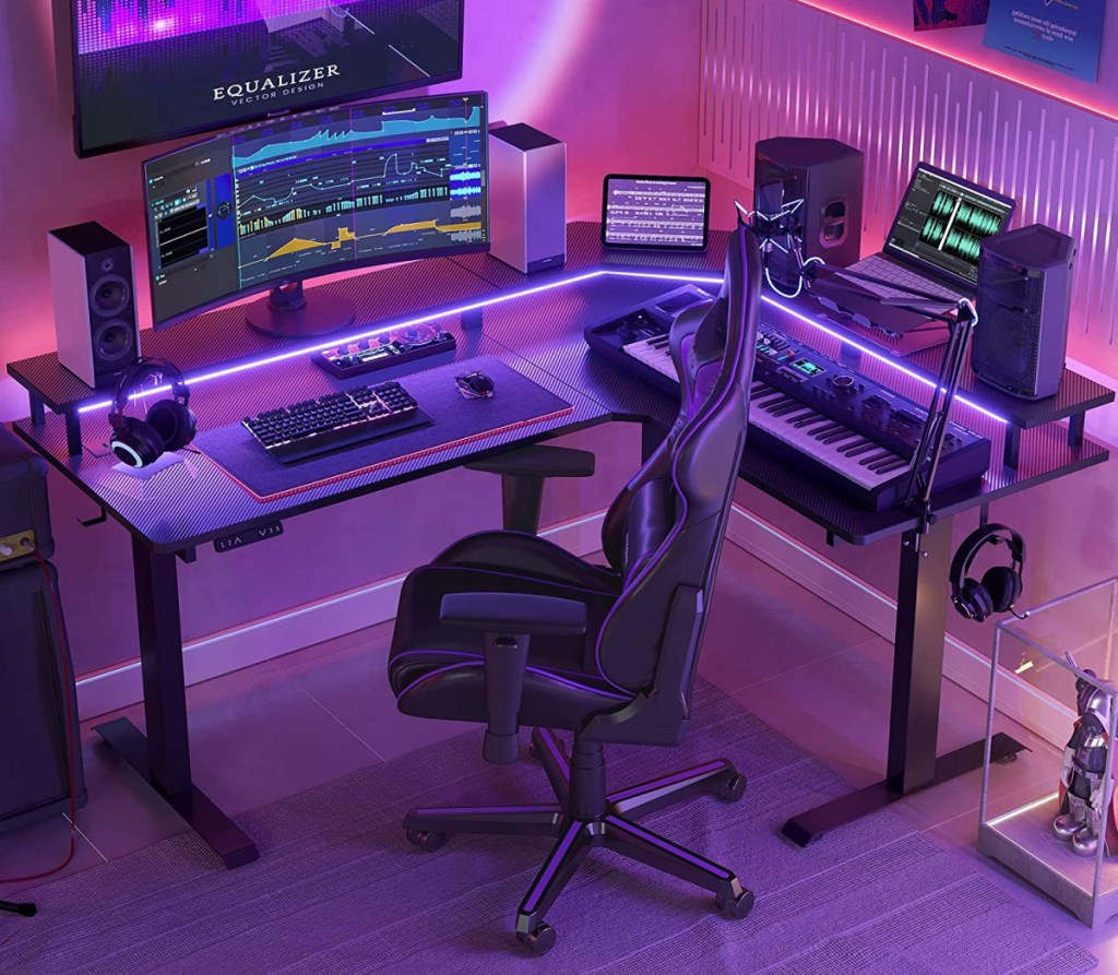 An L-Shaped height adjustable desk with LED lights for gamers 