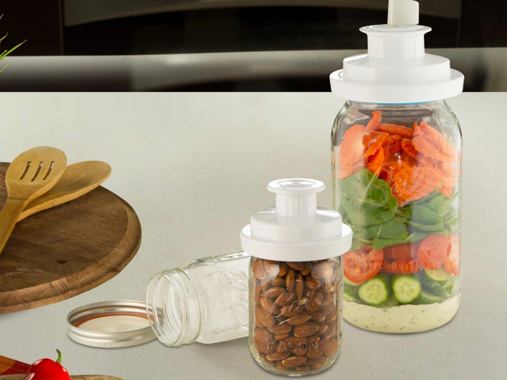 mason jars with foodsaver attachments on the lids