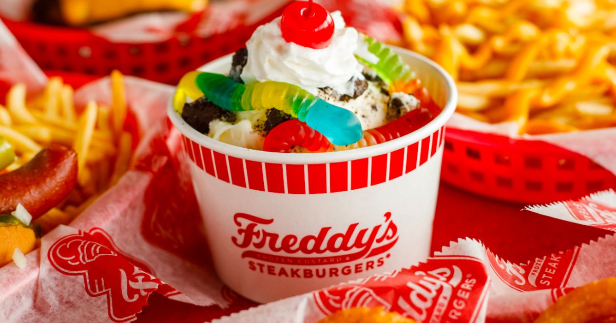 a custard bowl topped with gummi worms, whipped cream and a cherry from Freddys steak burgers