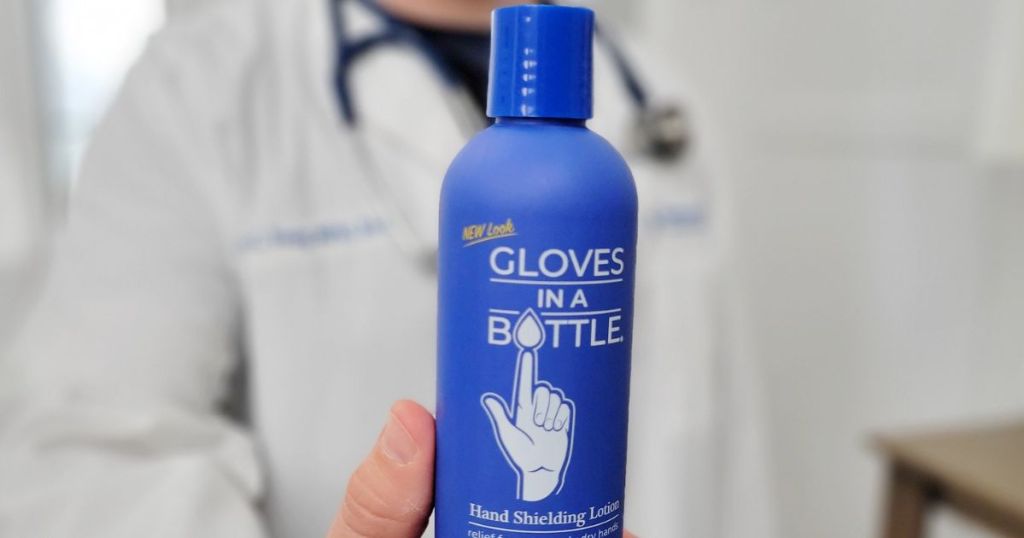 Gloves in a Bottle Lotion held up in front of person wearing a white medical coat and stethoscope