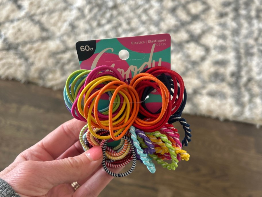 person holding up 60 pack of colorful goody hair ties