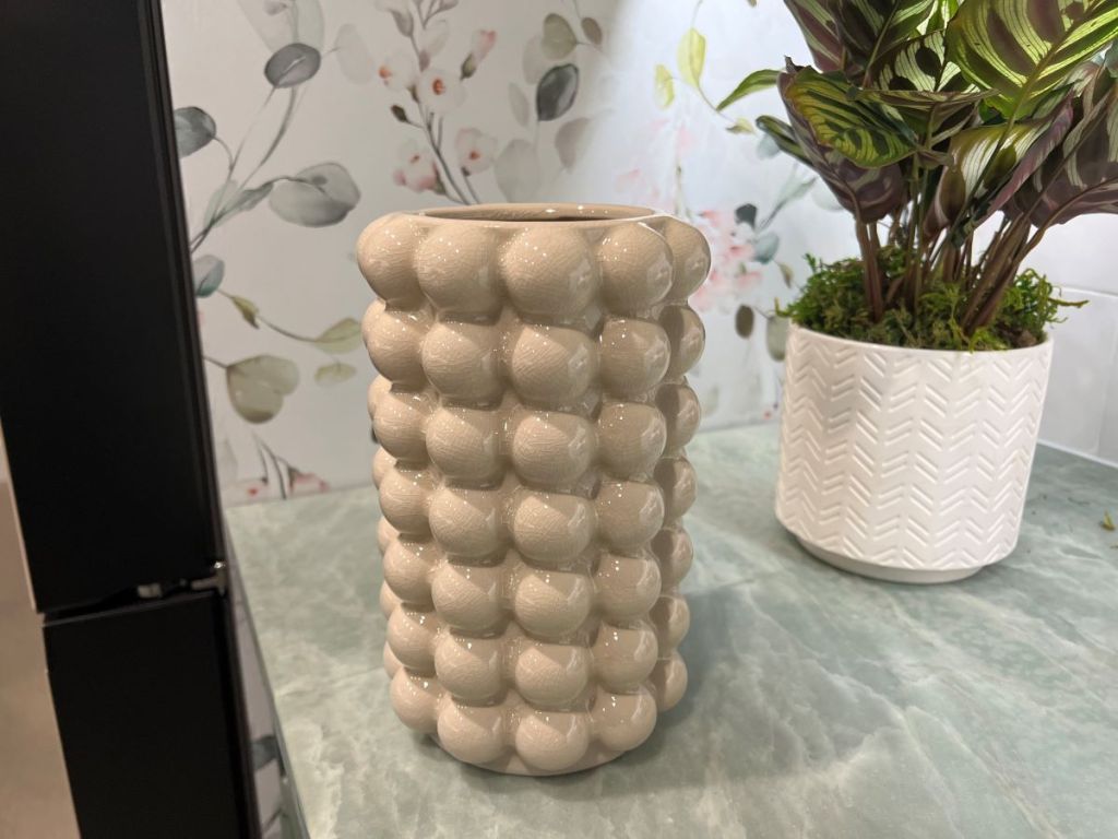 Tall vase that looks like it has bubbles all the way around it