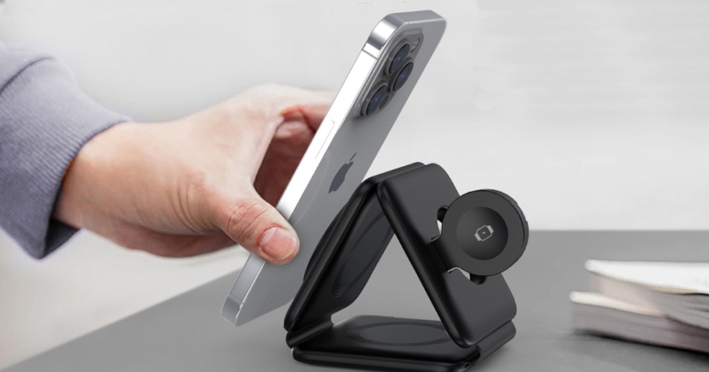 placing an iphone onto a magnetic charging station