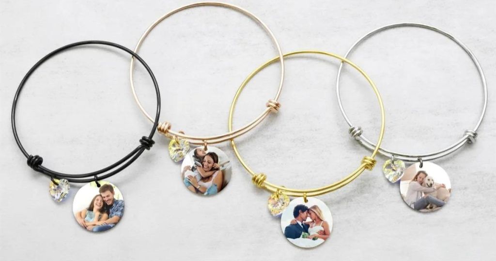 four bracelets in a row, each one has a custom photo and a charm on it
