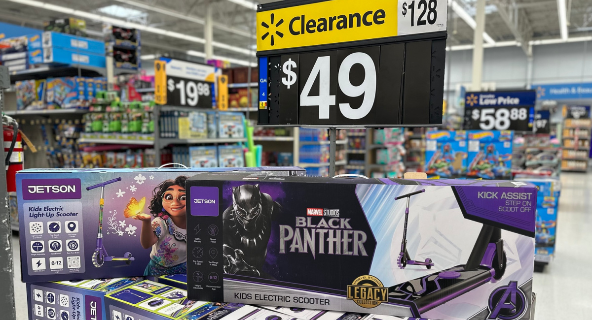 disney encanto and marvel black panther jetson scooters under a clearance sign on a walmart display