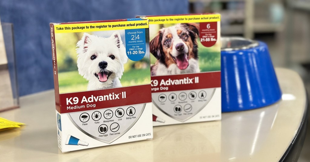 two boxes of K9 Advantix II Dog Flea & Tick Treatment near dog food bowl