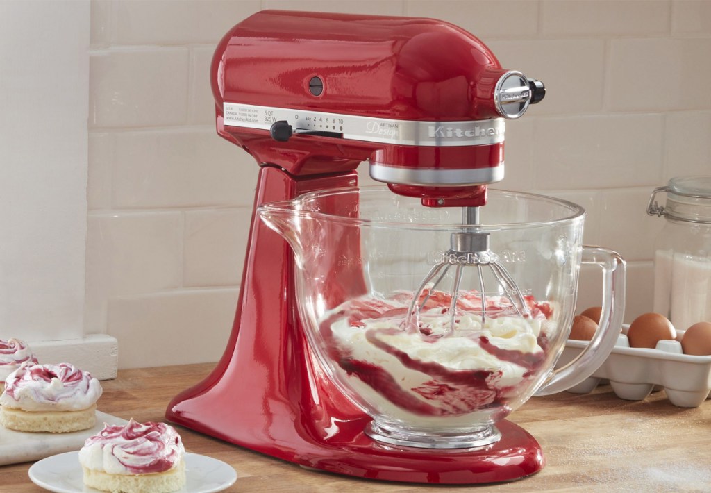 red kitchenaid mixer with glass bowl on kitchen counter