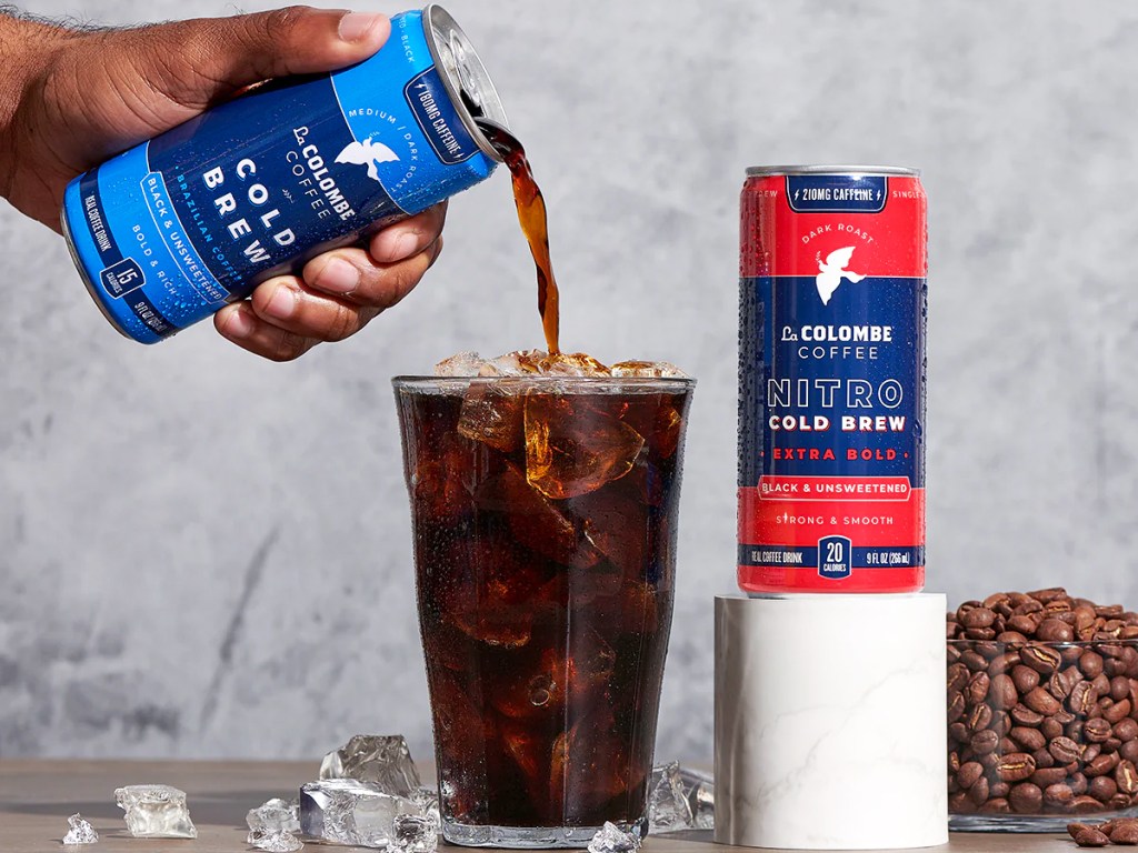 pouring can of cold brew coffee into glass