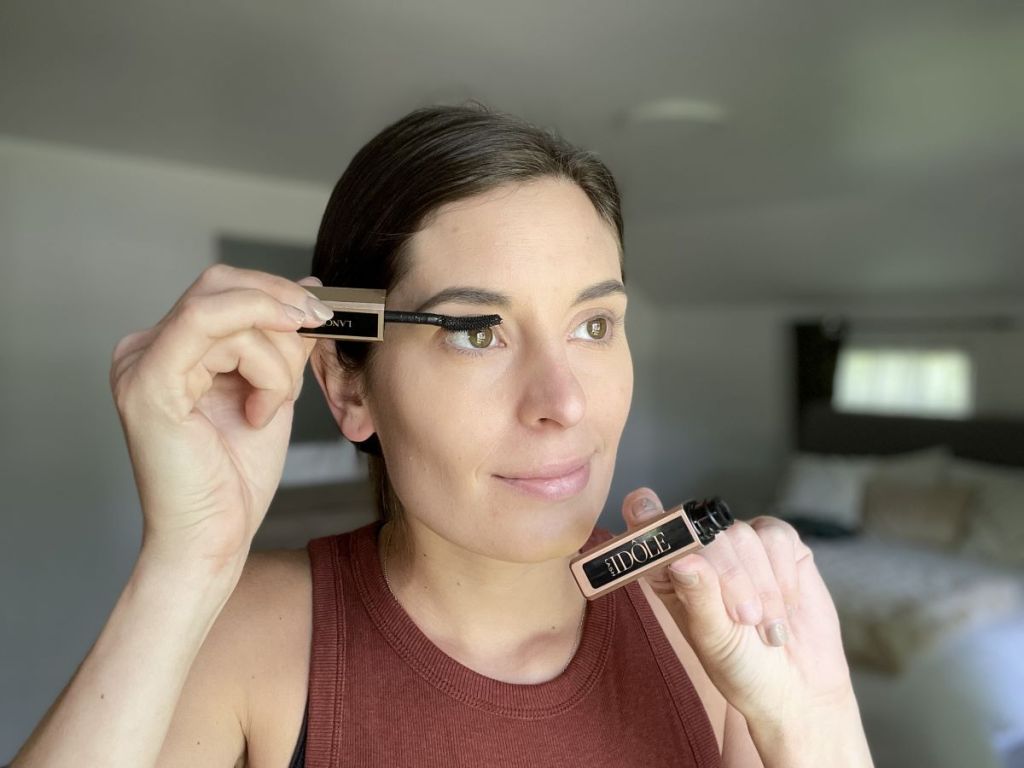 woman applying a Lancome mascara to her eyelashes