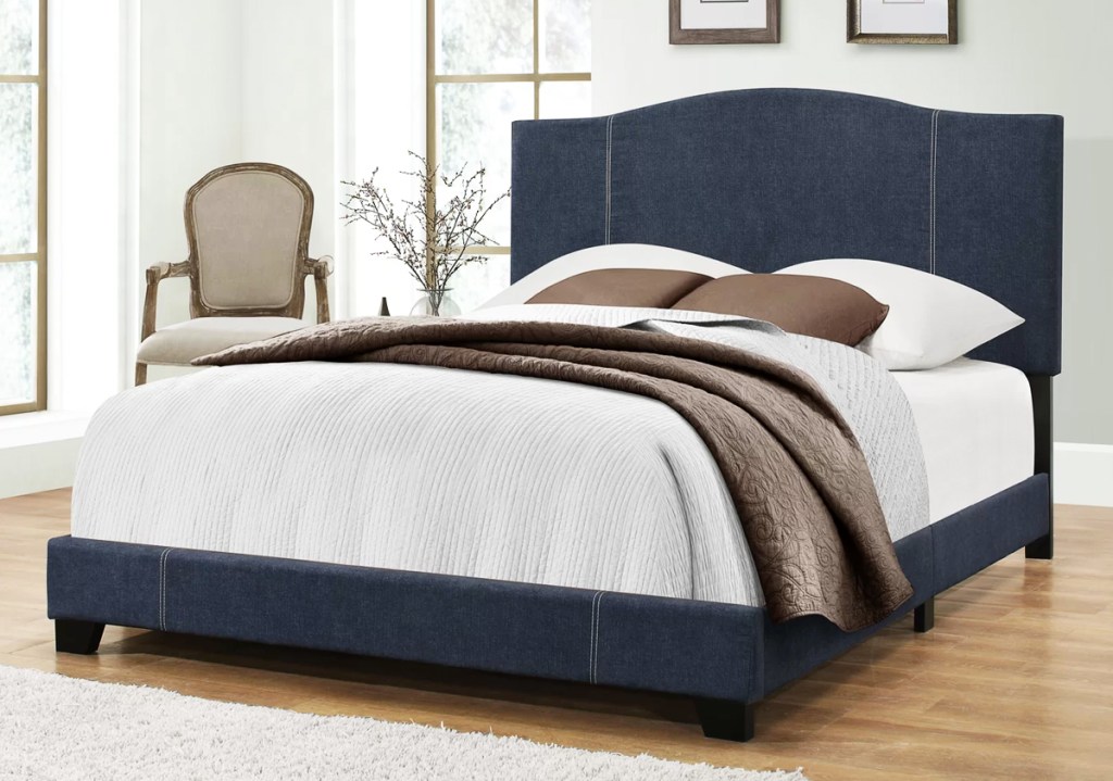 navy blue upholster bed in bedroom