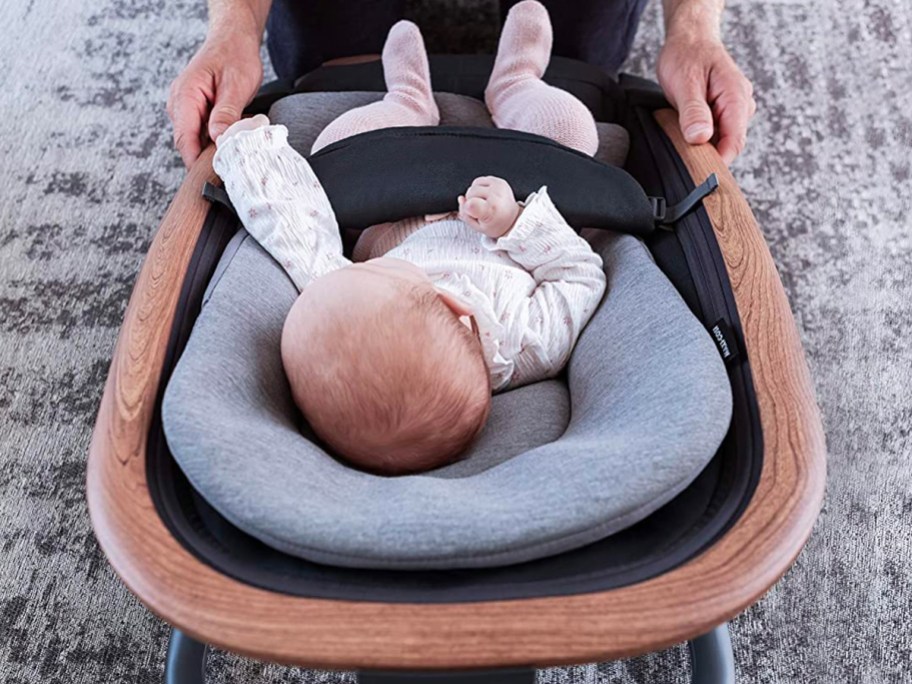 A Baby using the Maxi-Cosi Kori 2-in-1 Baby Rocker as it is one of the company that has teacher discounts for 2024