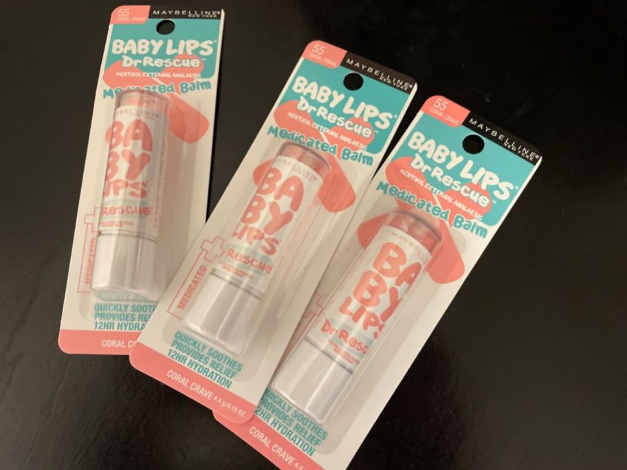 Three tubes of Maybelline Baby Lips lip balms on a table