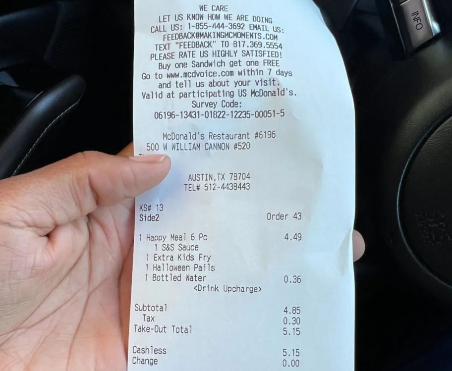 holding a McDonald's receipt