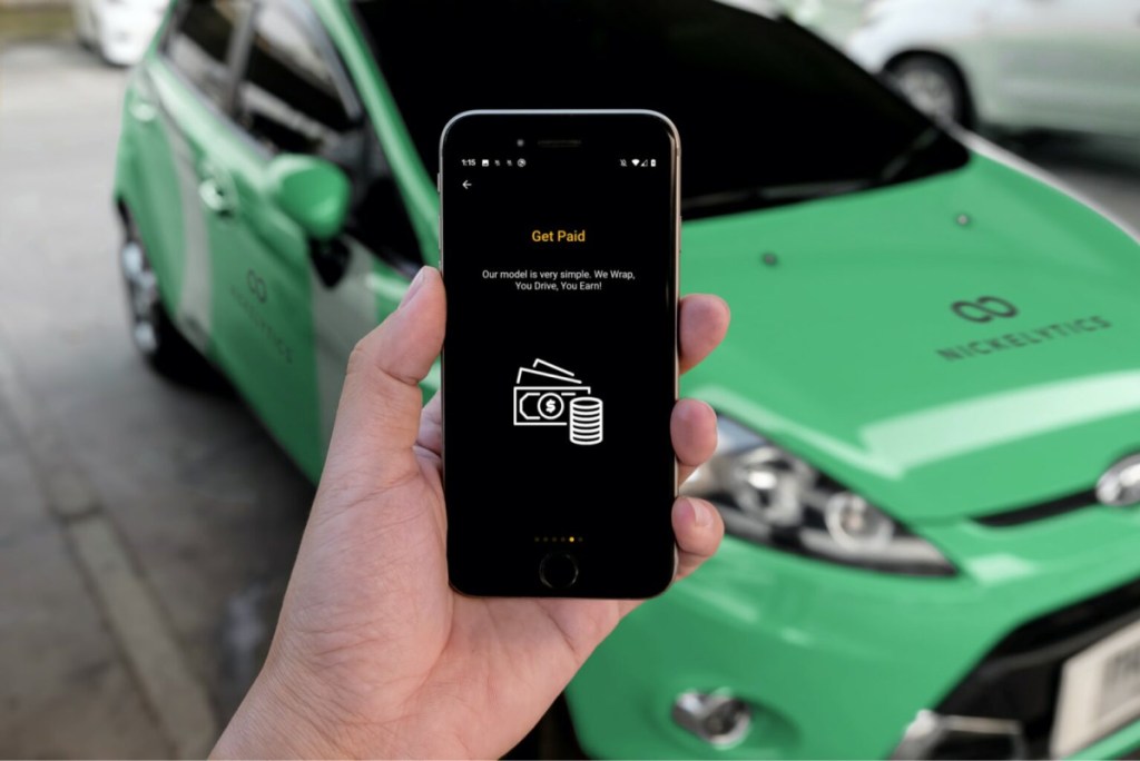 Man using the Nickelytics App to make money via car advertising 