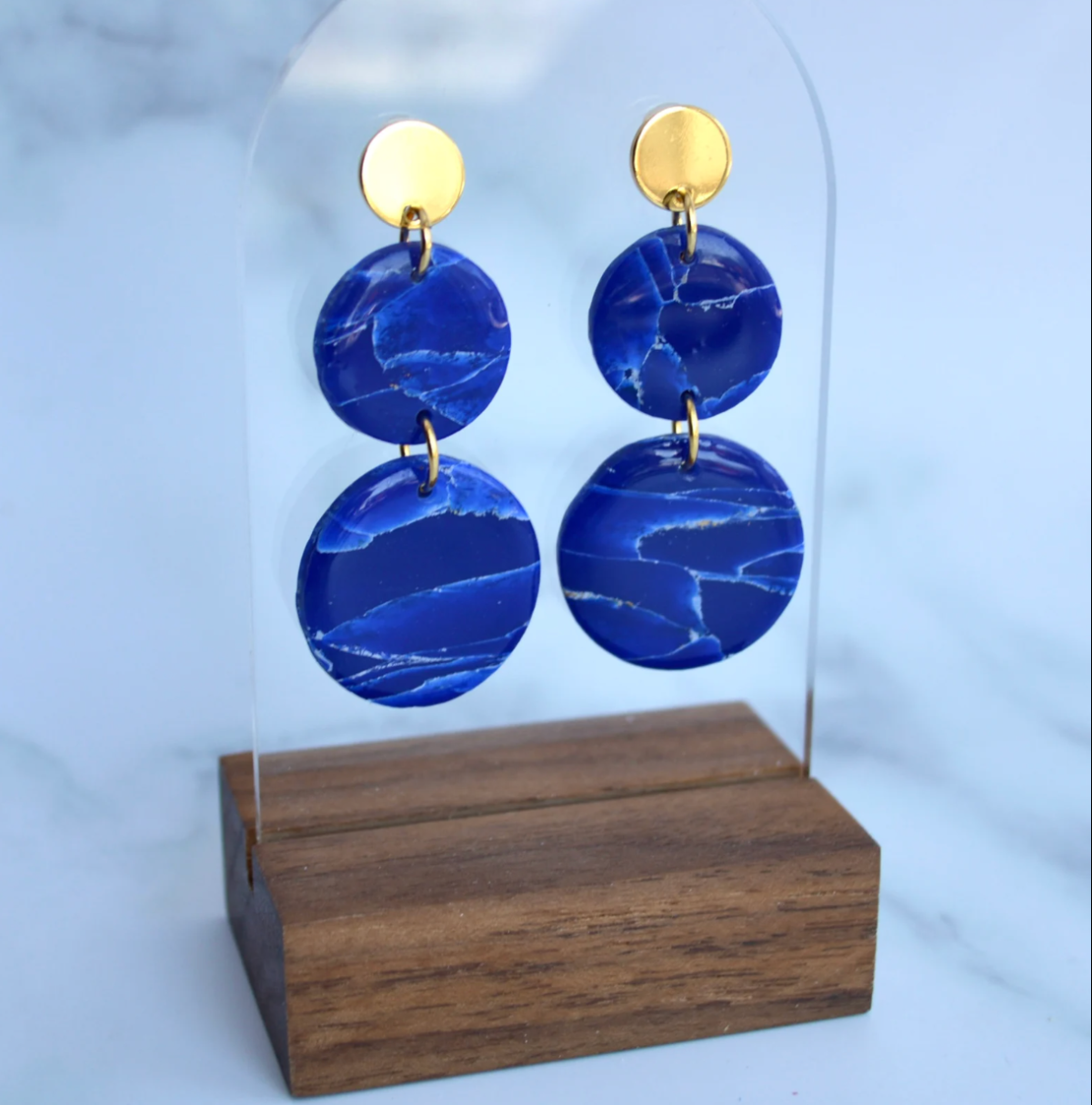 A pair of lapis lazuli earrings from Pache Studios on Etsy, one of the top black owned businesses