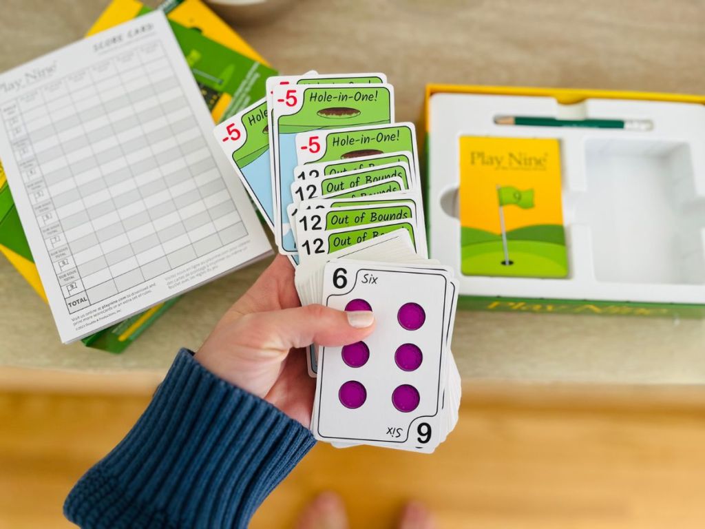 Play Nine card game with hand holding cards