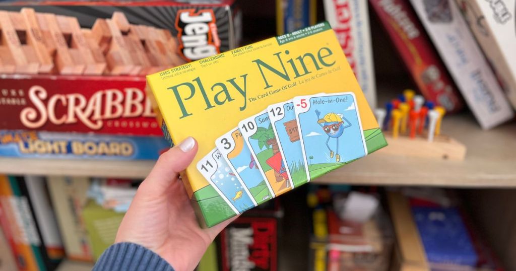 hand holding Play Nine card game 