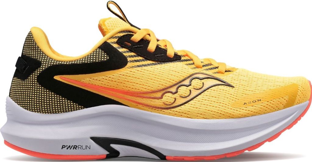 Gold, black, and white Saucony running shoe