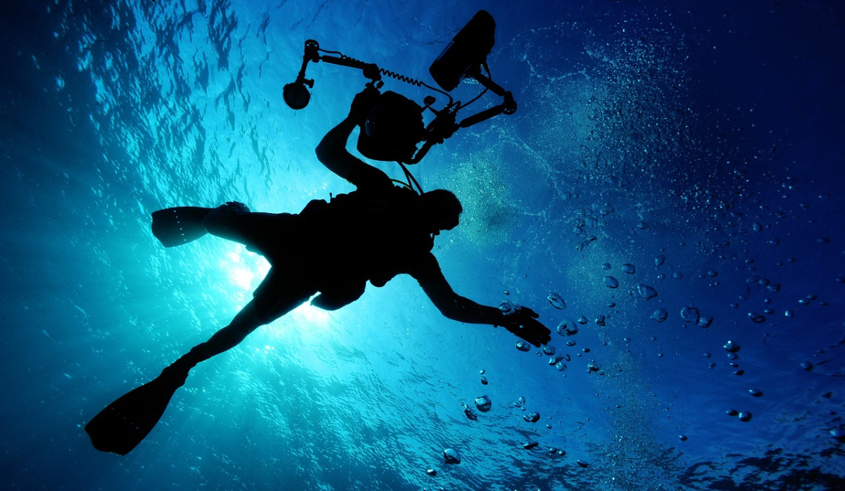 A scuba diver with a camera
