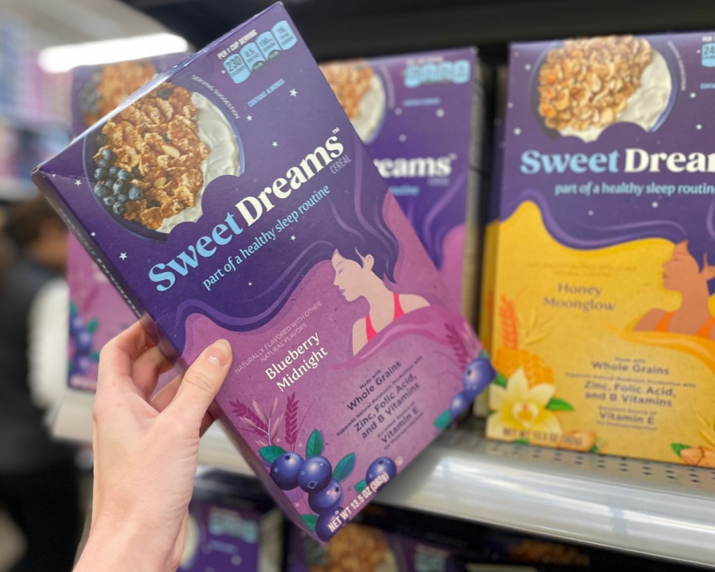 Woman Grabbing Sweet Dreams Cereal From the Grocery Store Shelf