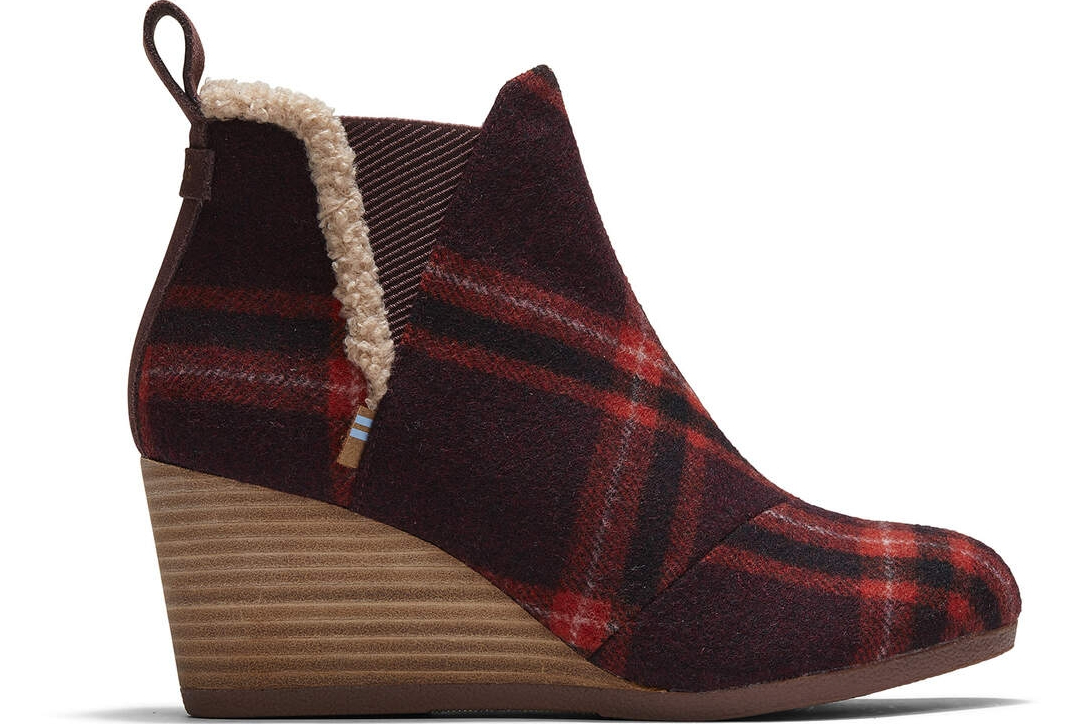 TOMS wedge bootie with red plaid upper and faux fur lining.