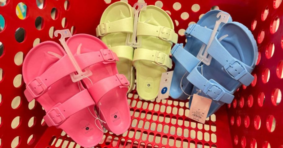 3 pairs of Shade & Shore 2-Strap sandals in pink, light green and blue in a Target shopping cart