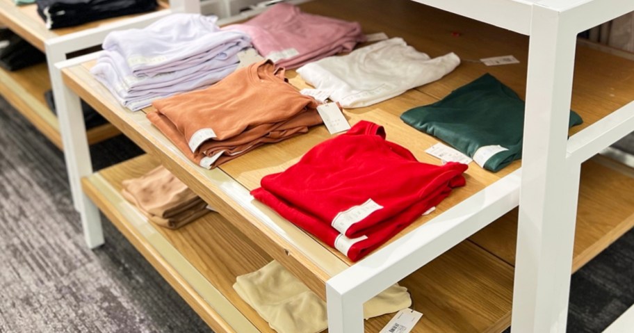 folded shirts on store display table