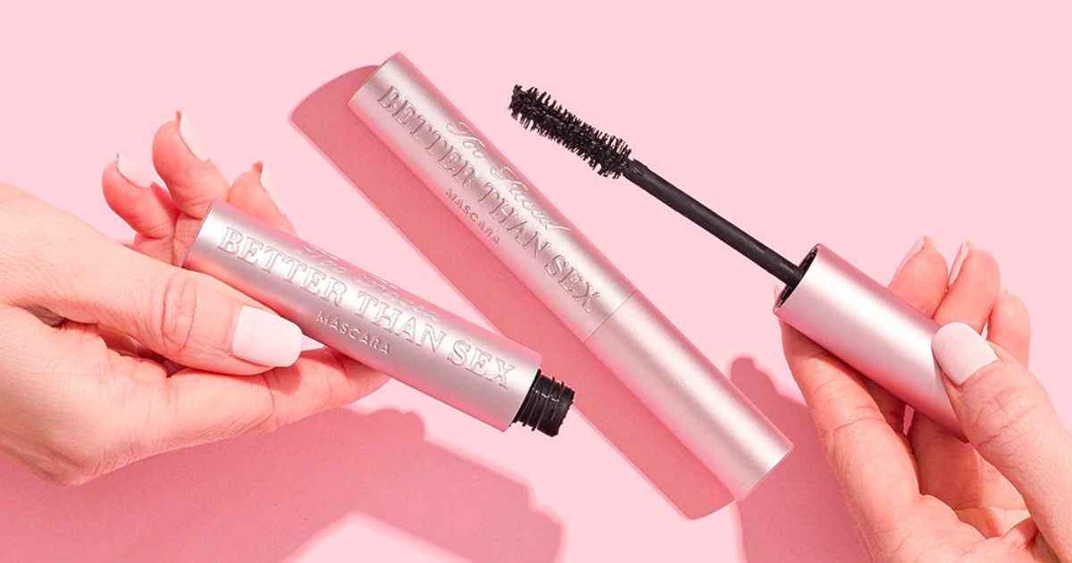 two womens hands holding tubes of too faced better than sex mascara 
