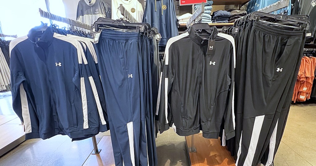 matching under armour jackets and pants on display in store