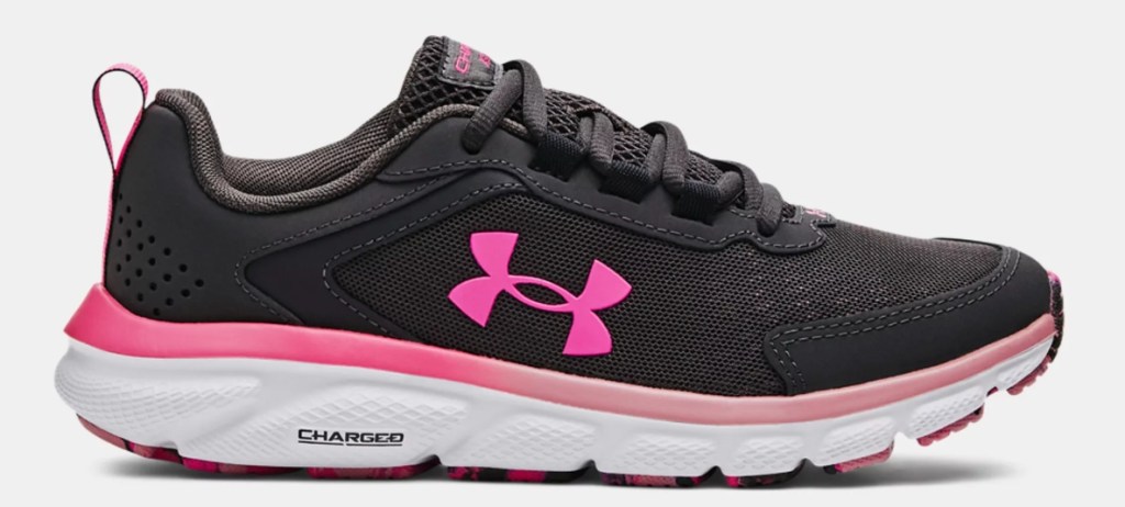 Black, pink, and white Under Armour running shoe