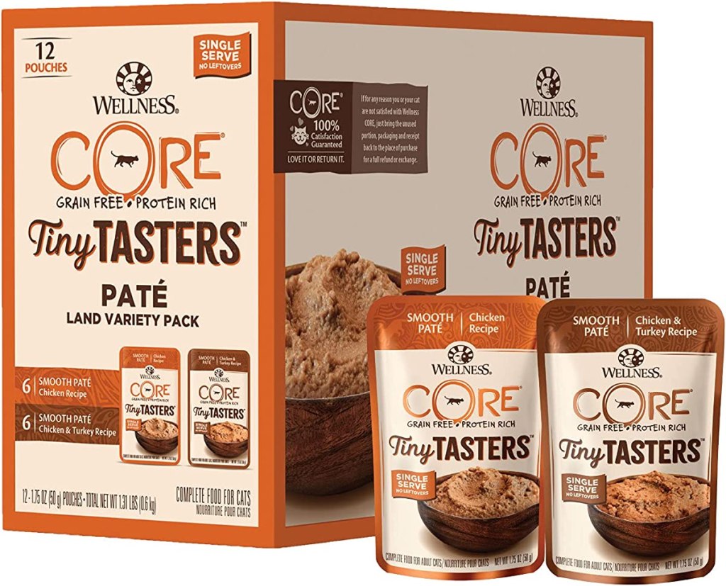 Two pouches of Wellness Core Tiny Tasters cat food next to the box they come packed in