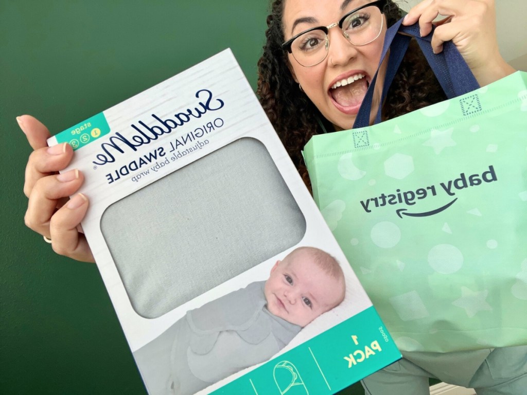 Woman standing next to Amazon's Baby Registry Bag