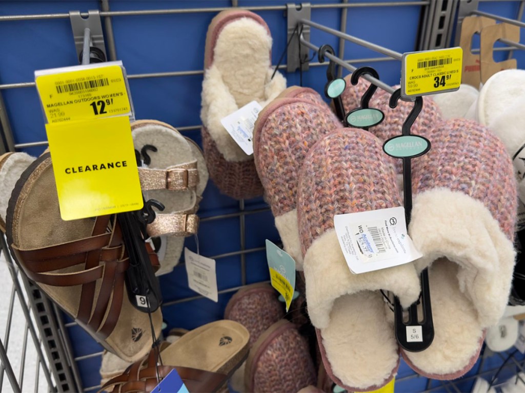 gold sandals and pink slippers at academy store